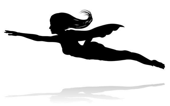 A woman caped superhero flying in silhouette