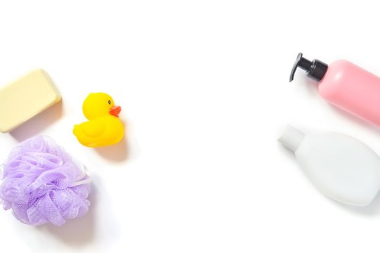 Flat lay photo baby bath products/ Baby soap, shampoo, shower gel and yellow rubber duck
