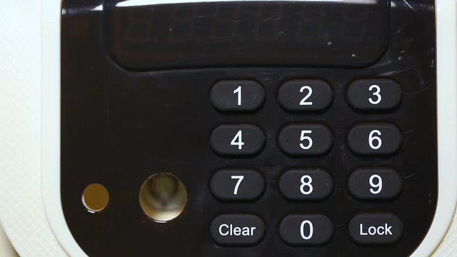 Woman uses modern electronic safe entering combination of four numbers to lock and unlock door. Wrong code and word Error written on display. Real time full hd video footage.