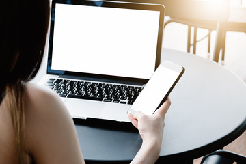 Close up of woman using mobile smart phone,sending massages on the garden.having sunbath.Phone with black screen,texting,video calls,