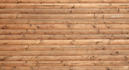 Wooden wall assembled of boards with nodes