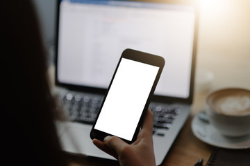 Close up of woman using mobile smart phone,sending massages on the garden.having sunbath.Phone with black screen,texting,video calls,