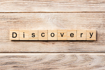 discovery word written on wood block. discovery text on table, concept