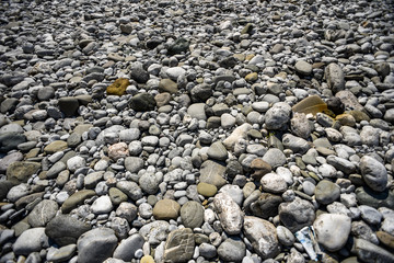 Texture of colored stones, different shapes and sizes.