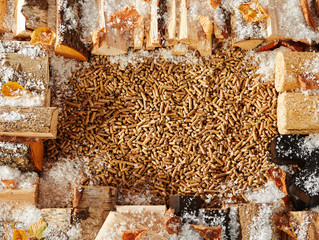 Border made of logs covered with light snow