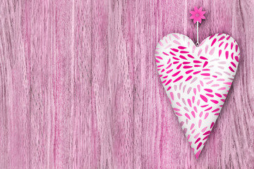 Heart against wooden background