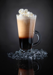 Cold coffee drink or cocktail with cream.