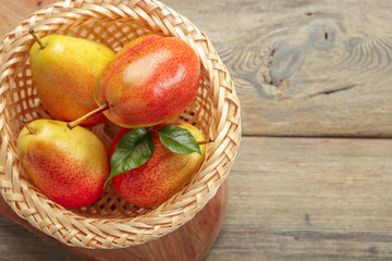 Ripe pears on rustic wooden table