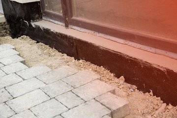 Waterproofing house foundation with spray on tar