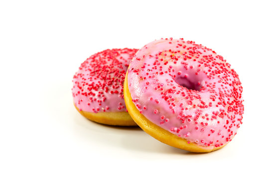 two fresh sweet pink donut with red sprinkles