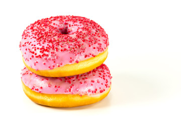 two fresh sweet pink donut with red sprinkles