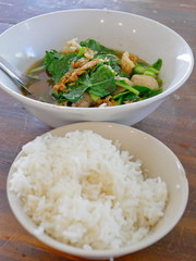 Selective focus of tasty Thai style vegetable stew pork soup with steamed rice ( Gaw Lao Kao Plaw ) - delicious and healthy street food in Thailand