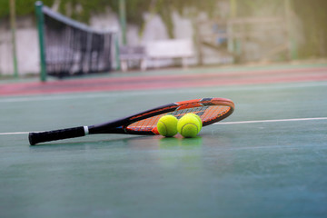 Tennis Ball and Racket on the Court