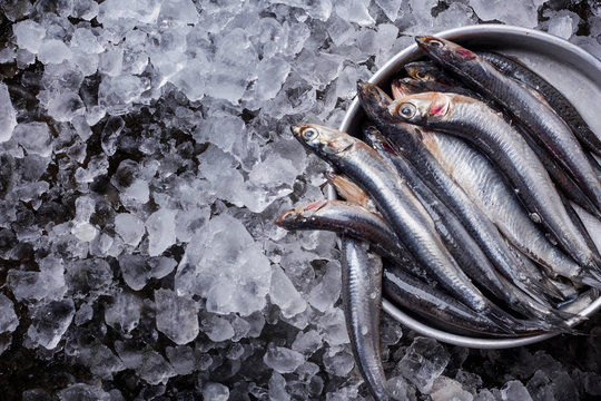 Raw anchovies with salt and lemon
