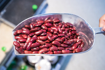 Close up Raw red beans on a scoop in the market. wholegrain  for clean food and lean food. healthy vegetable food. iamge for object and copy space.