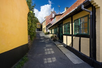 Fototapeta na wymiar Traditional colorful half-timbered houses in Gudhjem, Bornholm, Denmark