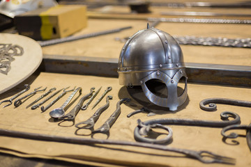Blacksmith decorative elements at forge, workshop. Handmade, craftsmanship and blacksmithing concept