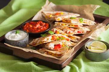 mexican quesadilla with chicken, tomato, sweet corn and cheese