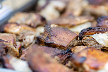 Close up photo of roasted pork meat served on a buffet tray