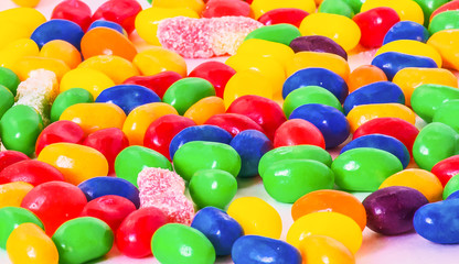 Fototapeta na wymiar Multicolored small round candy. Bright festive tasty background