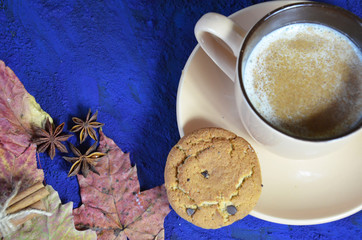 Obraz na płótnie Canvas coffee cookies and spices on dark blue background. stylish winter or autumn flat lay. space for text. cozy mood autumn. seasonal holidays concept. blogger.
