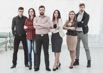 Fototapeta premium portrait of a professional business team standing in the middle of the spacious office