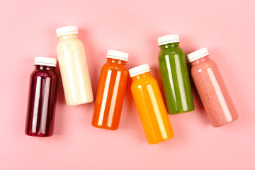 Bottles of multicolored smoothies - 221961290