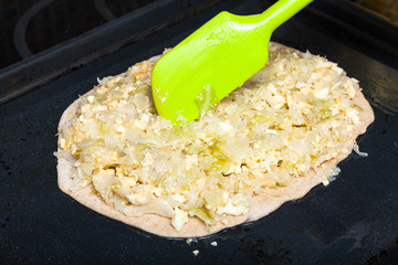 sheet of dough with stuffing from eggs and cabbage