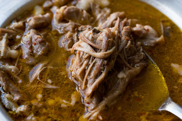 Turkish Soup Beyran with Lamb Meat, Rice, Chopped Garlic and Vinegar Sauce Served with Salad.