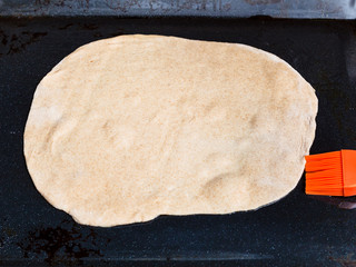 sheet of raw dough on baking tray