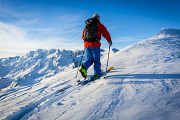 Ski with amazing view of swiss famous mountains in beautiful winter snow Mt Fort. The skituring, backcountry skiing in fresh powder snow.