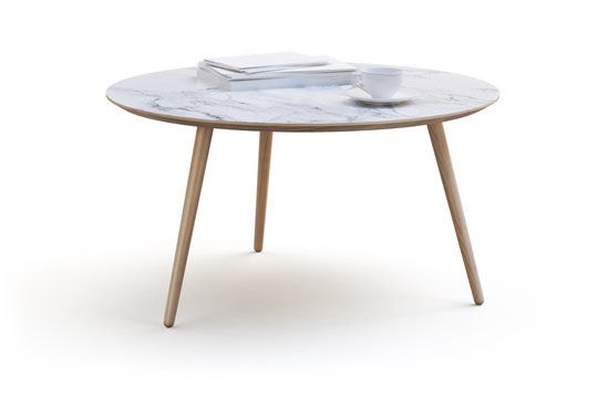 Modern white round coffee table on thin legs and marble countertop. 3d render
