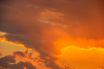 View of the sky during a beautiful orange sunset with clouds.