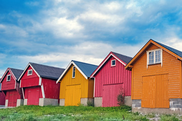 Colorful wooden houses standing next to each other.