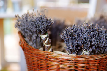 Bunch of dried lavender bouquets in wicker basket