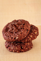 Chocolate oats cookies with chocolate nuts spread. Selective focus.