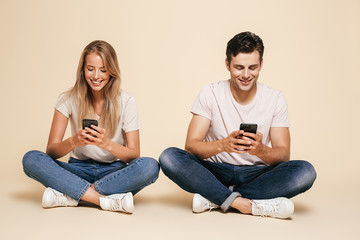 Portrait of a happy young couple sitting together