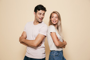 Fototapeta premium Portrait of a happy young couple standing together