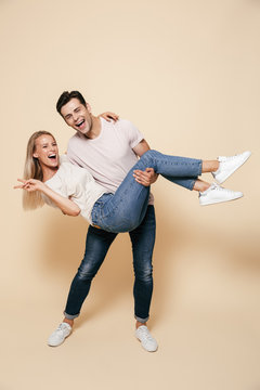Full length portrait of a cheerful young couple