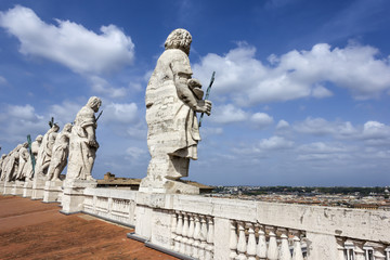 Fototapeta na wymiar Statues of Saints on the Dome of St Peter's Cathedral in Vatican