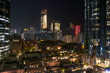 Fototapeta premium Abu Dhabi city towers and skyline at night - WTC and the mall
