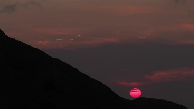 a firey vivid sunset in hte picos de europa, asturia, spain