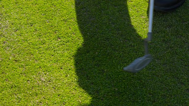 detail of Golf and a shadow of the athlete