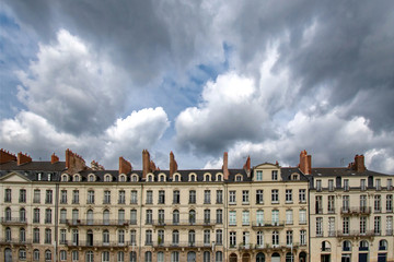 Fototapeta na wymiar Buildings in Nantes with cloudy sky