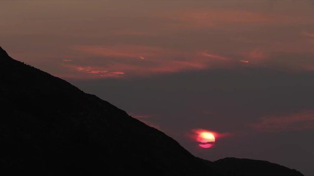 a firey vivid sunset in hte picos de europa, asturia, spain