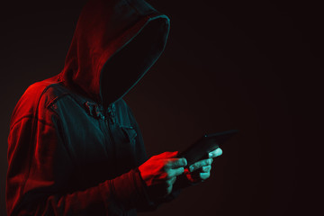 Hooded faceless hacker
