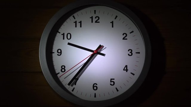 5 minutes timelapse close up shot of office clock on dark wood wall background. 4K.
