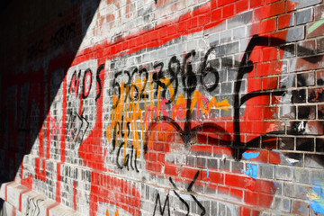 Wall with sun and grafiti