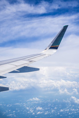 Sky and cloud as seen through window of an aircraft