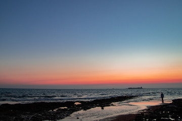 Fototapeta na wymiar Colorful sunset at the beach